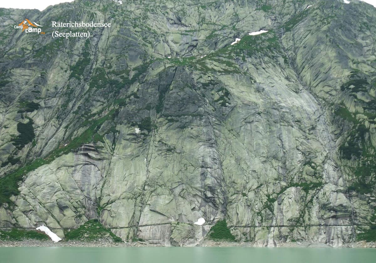 The Seeplatten seen across the Räterichsbodensee. The horizontal line just above the water is the big path cut across the slabs, where the routes start.