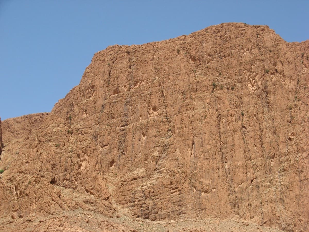 The Paroi du Levant face on: the multipitch routes take the centre of the wall above the scree.