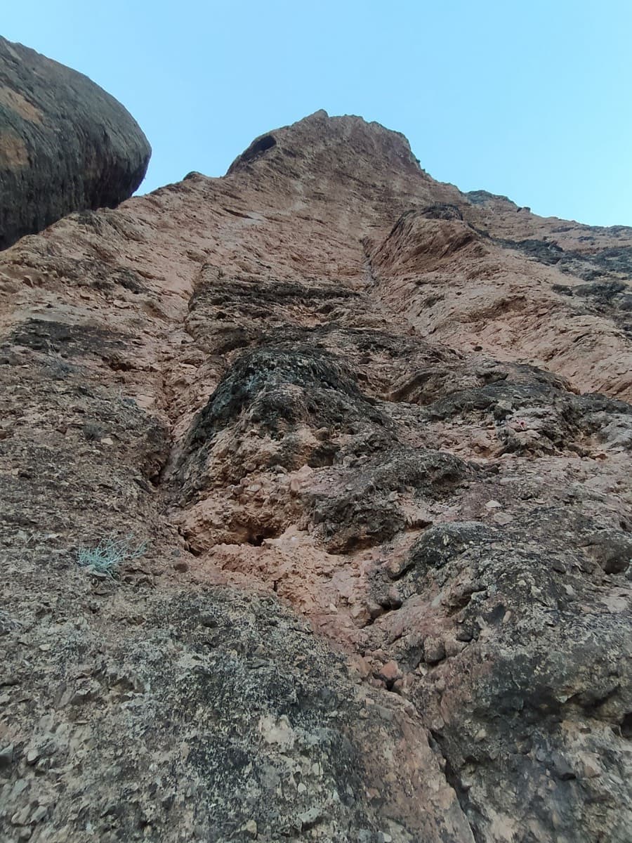 Looking up from the start of the route (photo titled 'Départ' by a 2023 party).