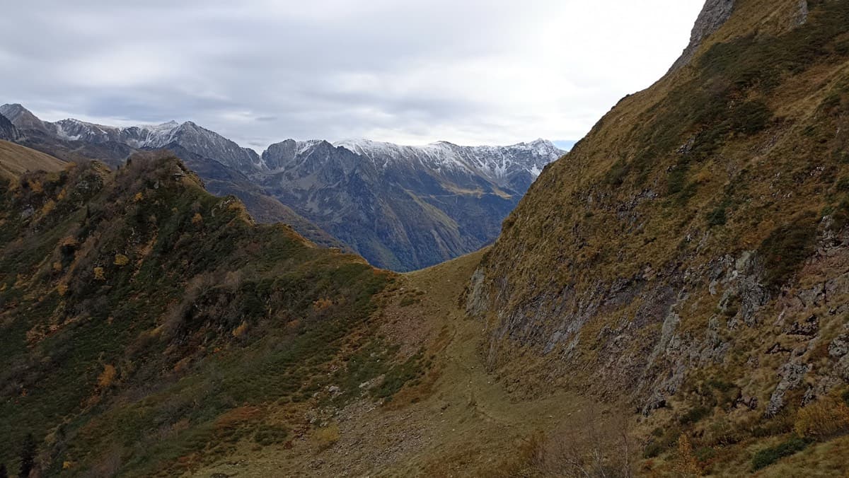 On the walk-in: the path leads to the col ahead, and the starts of the east-face routes are just behind it.
