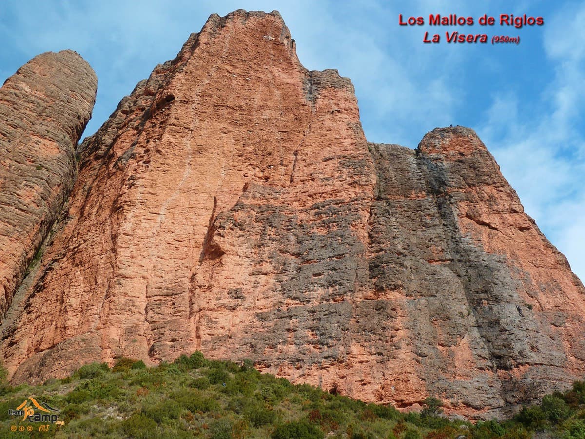 La Visera, labelled, seen from below; the routes climb the big overhanging orange face.