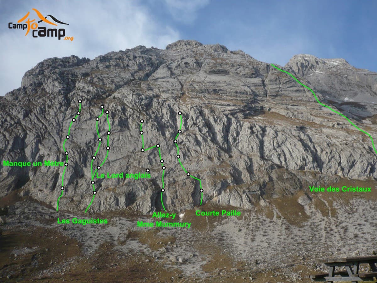 The south face of the Pic de Jallouvre with route lines; the Voie des Cristaux is the long line on the right