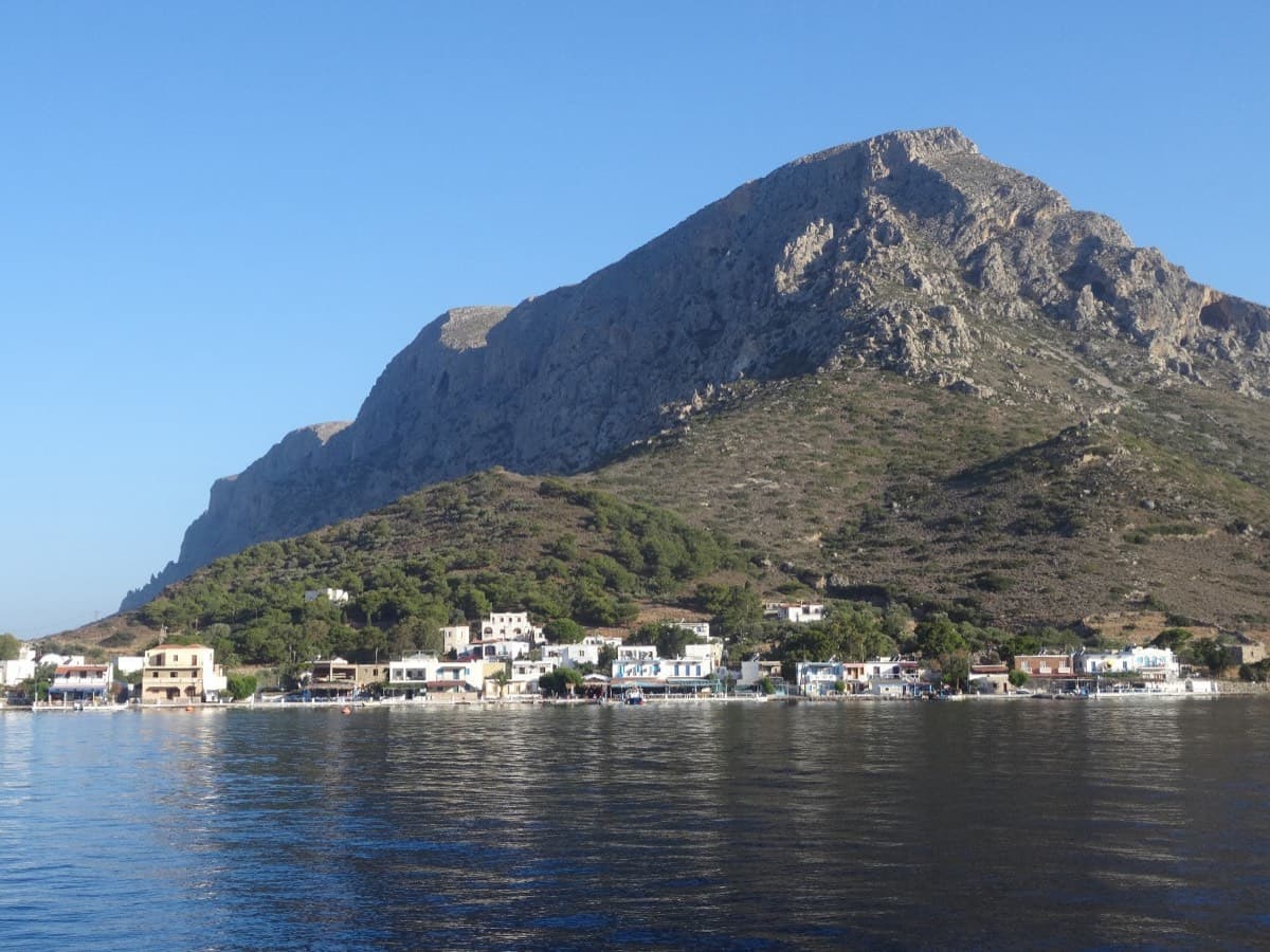 Telendos harbour and the south face of the island, seen from the water