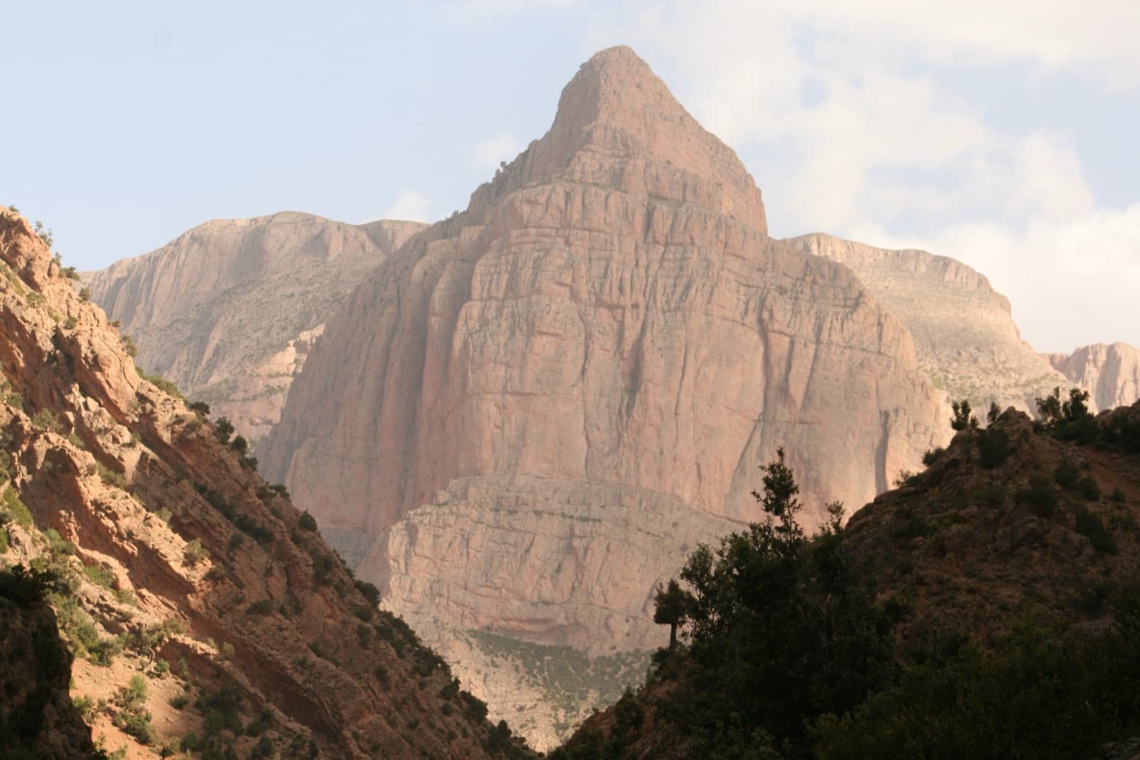 A limestone tower rising between the canyon walls of the Taghia gorge.