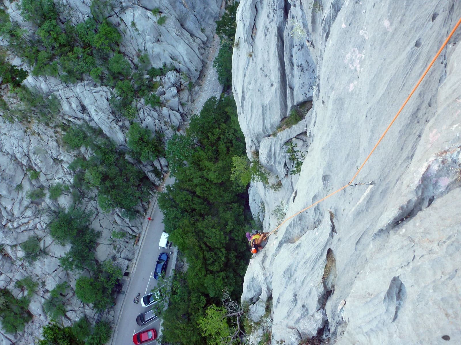 Looking down the fluted wall of Dreaming the Lost Friends to the road at the canyon entrance.