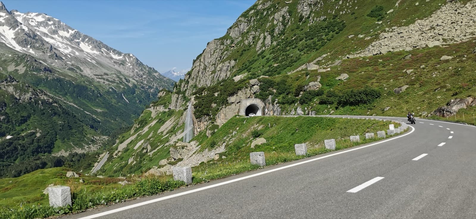 The Susten pass road and its tunnel just above Steingletscher, under the slabby rock of the pass's south side.