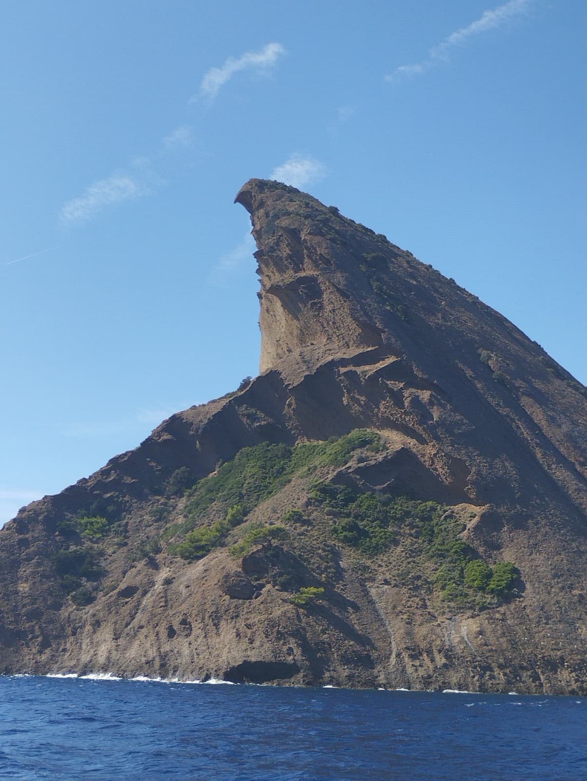 The Bec de l'Aigle and its overhanging beak seen from the sea off La Ciotat.