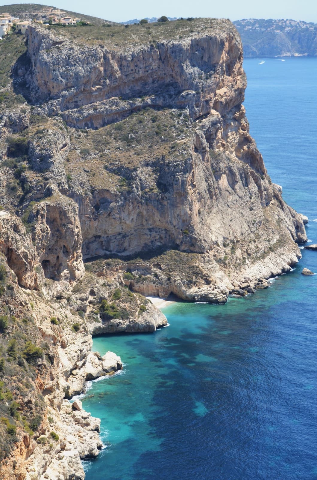 Morro Falquí and the turquoise Cala dels Testos at its foot.