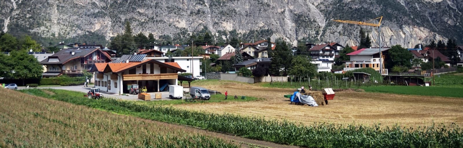 The village of Haiming beneath the limestone cliffs on the north side of the Inn valley, where the Geierwand stands.