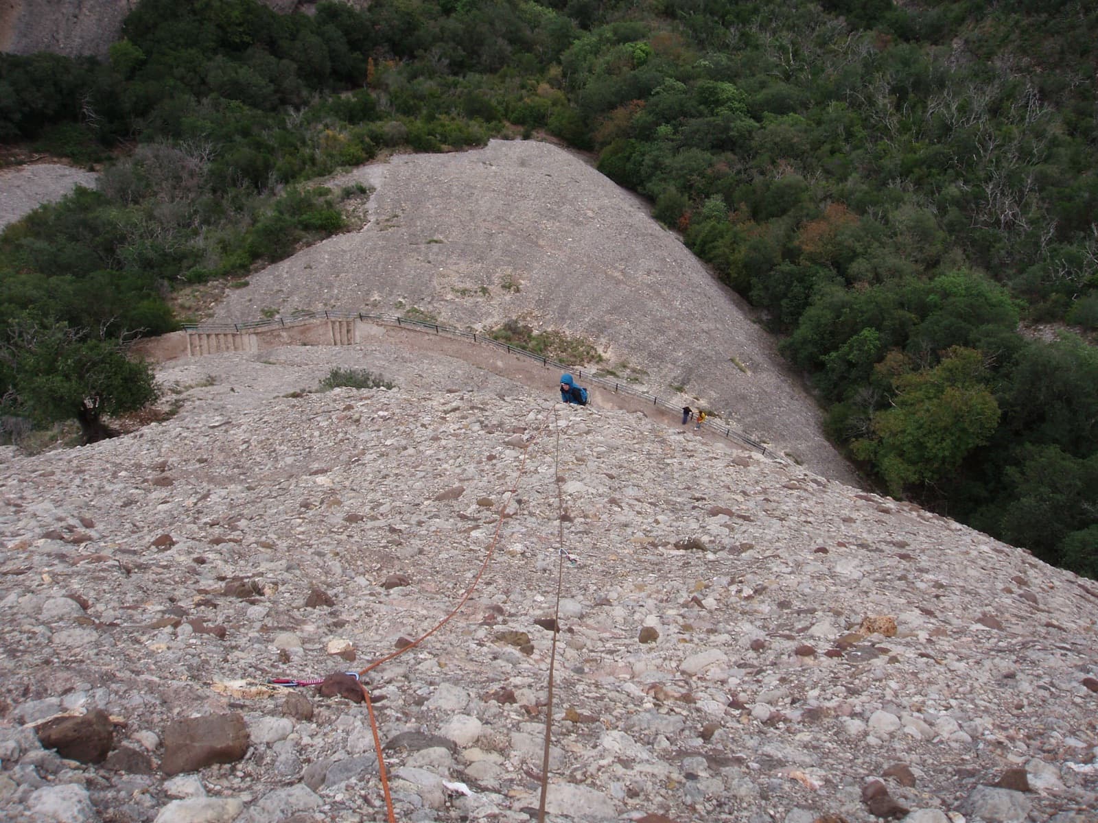 Starting up the conglomerate of Via del Carles with the Sant Jeroni path below.