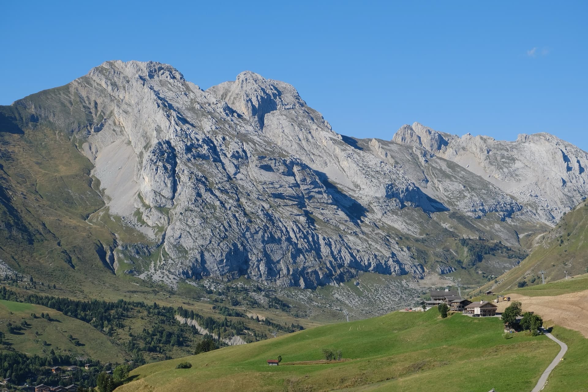 The south face of the Pic de Jallouvre (left summit) and the Pointe Blanche above the chalets of Le Grand-Bornand, on the road to the Col de la Colombière; the Voie des Cristaux climbs the right-hand side of the Jallouvre face.