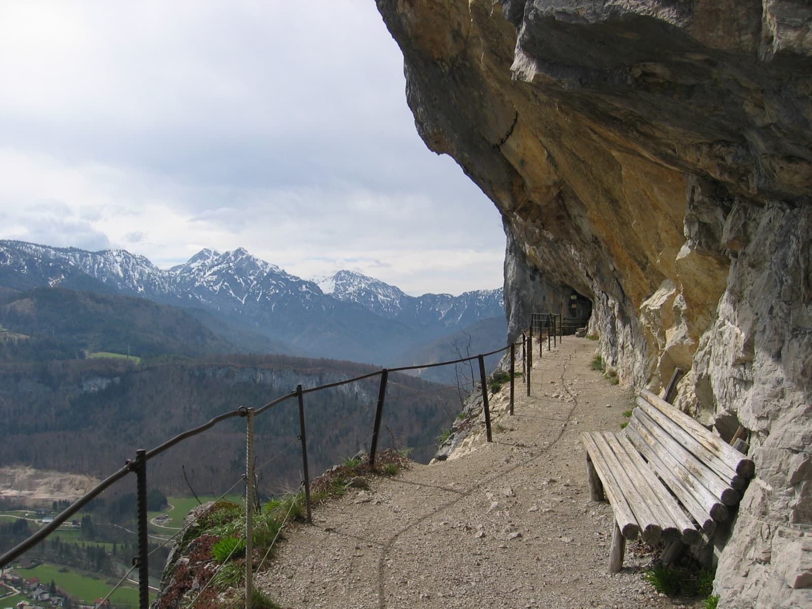 The path cut beneath the overhangs of the Ewige Wand, looking out over the Goisern valley.