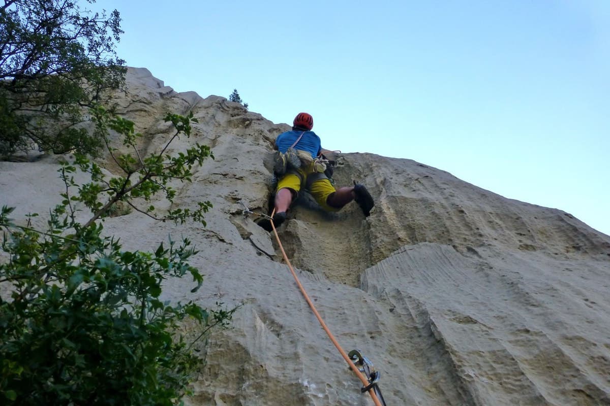 Climber on the fluted limestone wall of Dreaming the Lost Friends, Kuk od Skradelin