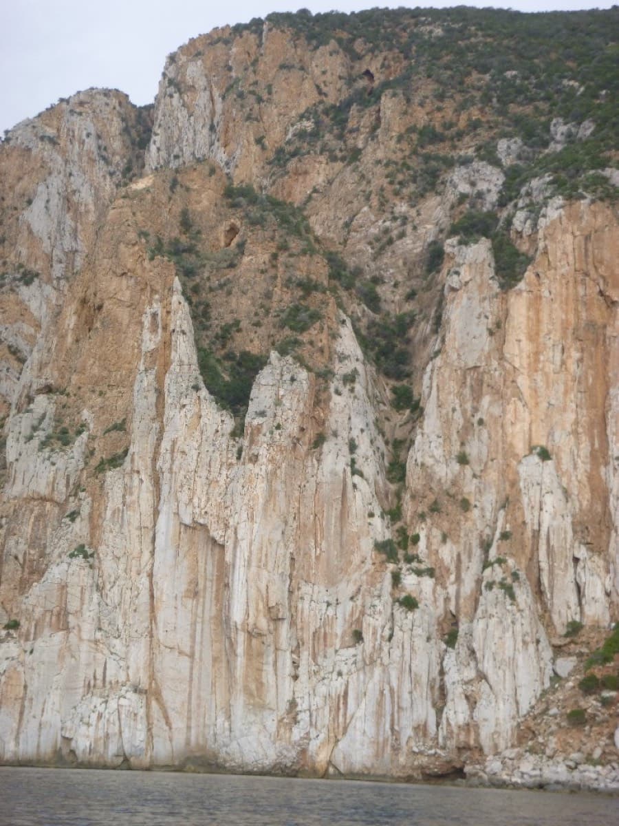 The Masua sea cliffs seen from the water