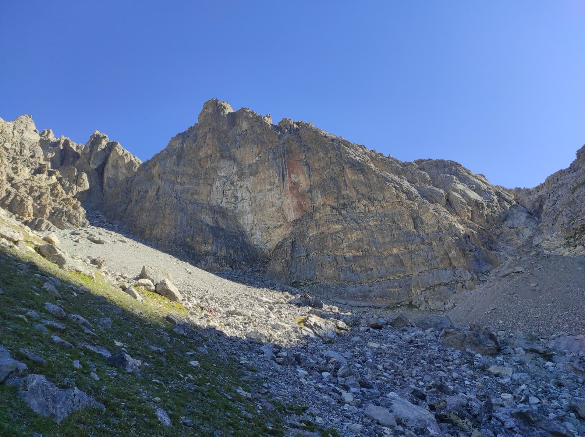 The face of the Tour Termier above its scree bowl in the Cerces; Feu Sacré climbs this wall, the line is not marked.