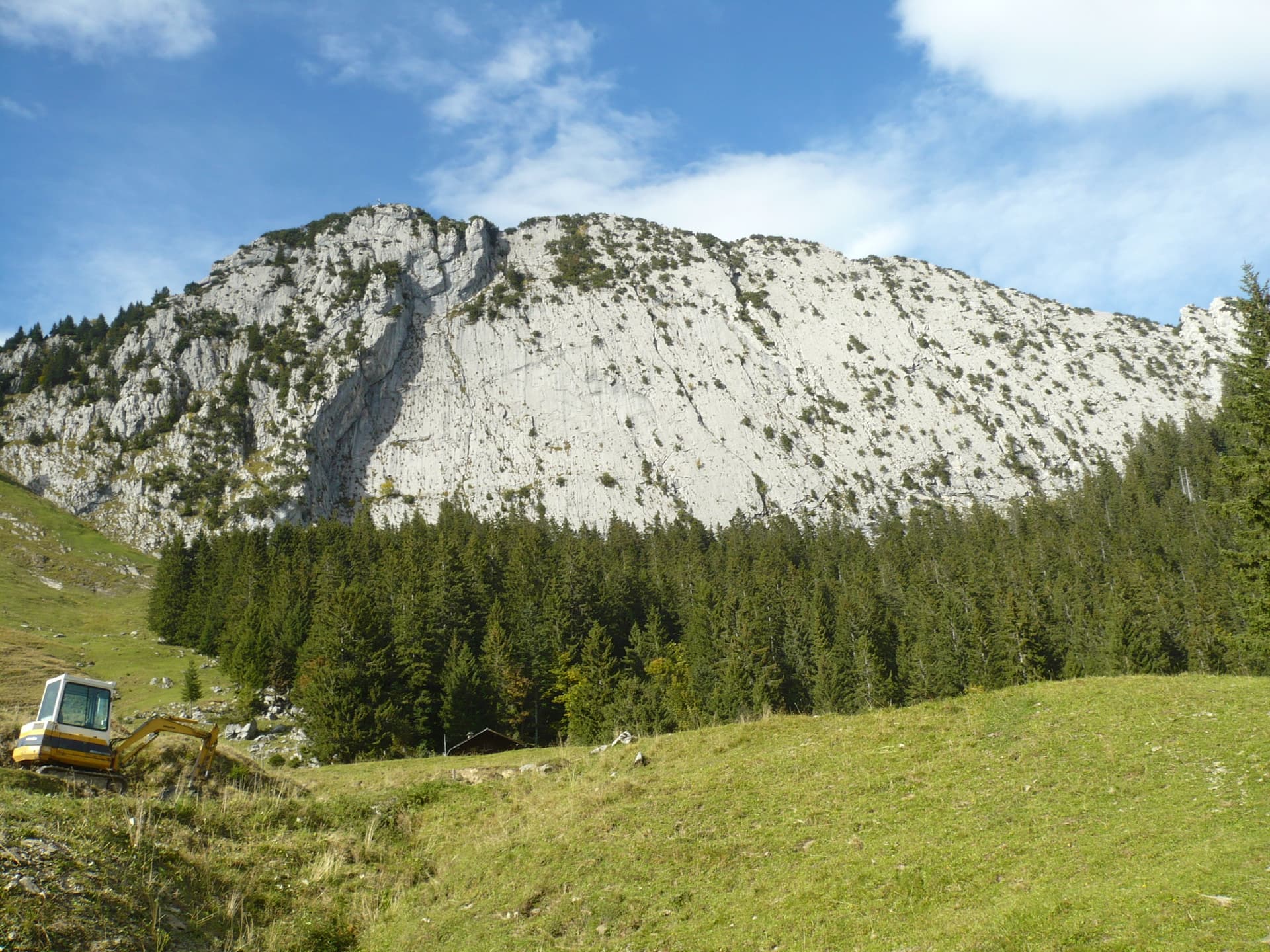 The slabby south face of the Brüggler above the pastures of the Schwändital.