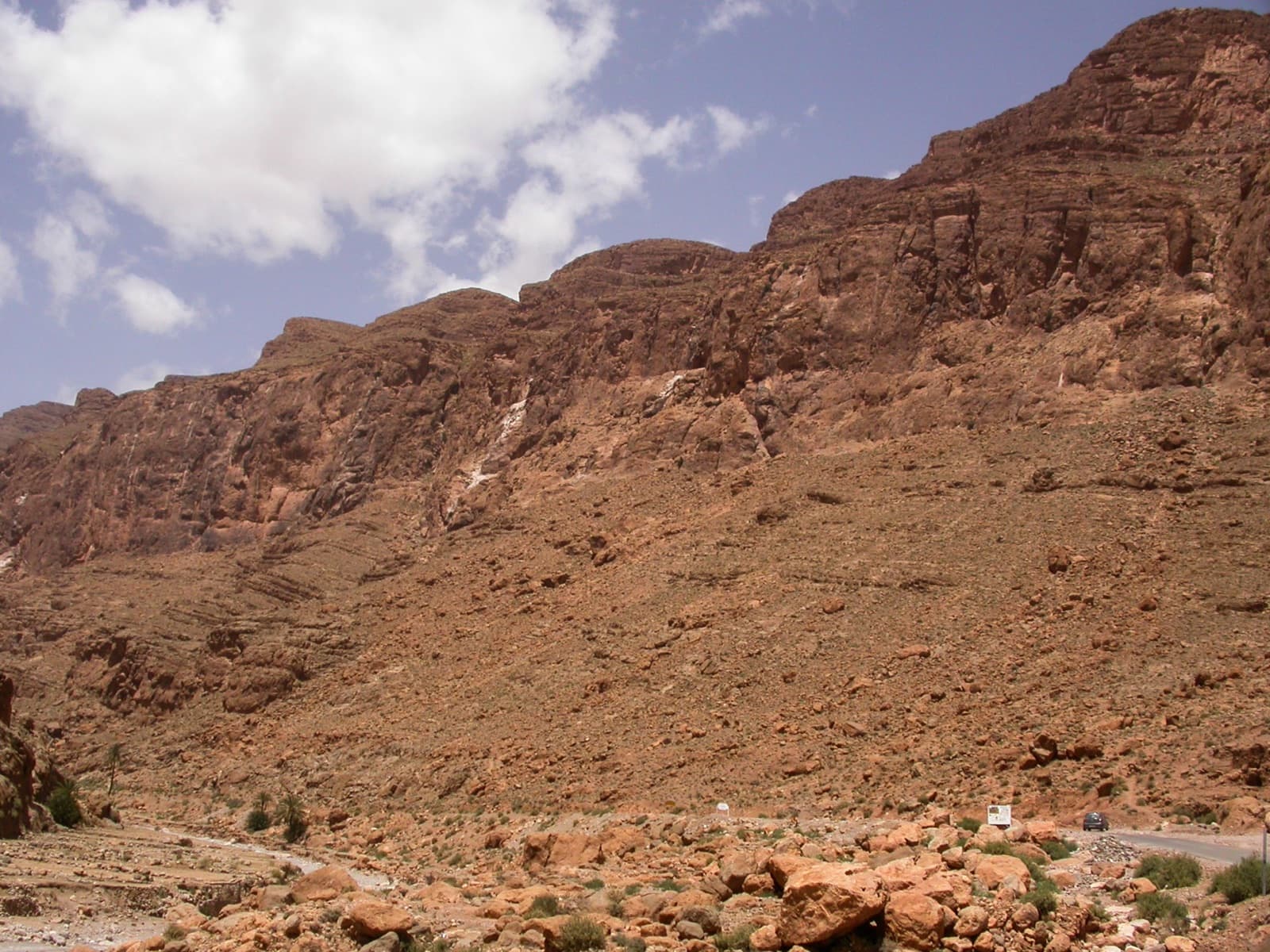 The band of cliffs above the road upstream of the Todra narrows, the side of the valley on which the Mur du Scorpion lies.