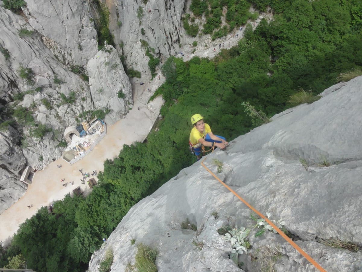 Climber on pitch 3 of Karamara Sweet Temptations, Veliki Ćuk, above the Paklenica canyon floor